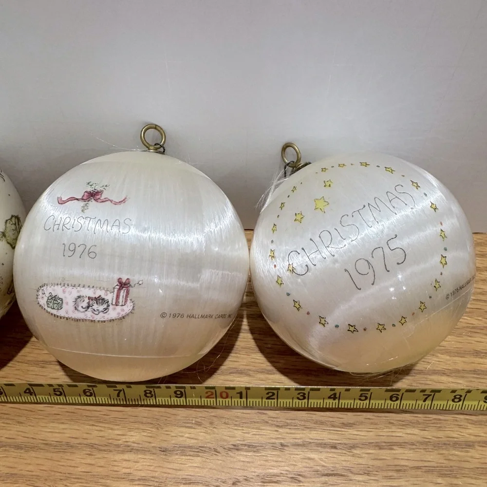 Vintage hallmark Ornament bulbs dated 1974, 1975, 1976